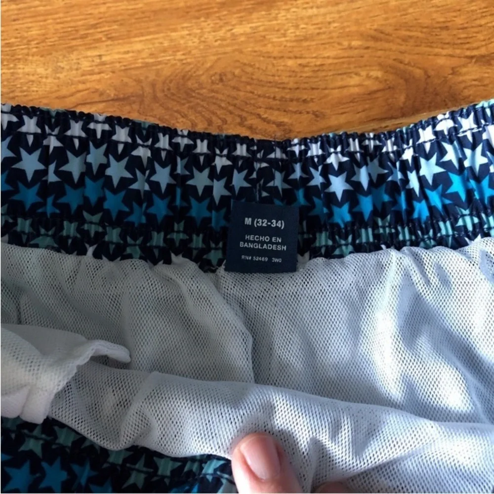 George blue striped star pattern swim trunks in size M (32-34)